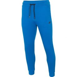 Spodnie dresowe męskie SPMD301 - kobalt. Spodnie dresowe męskie marki 4f. Za 119.99 zł.