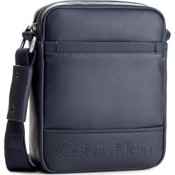 Saszetka CALVIN KLEIN - Bennet Reporter K50K503278 411. Saszetki męskie marki Calvin Klein. W wyprzedaży za 259.00 zł.