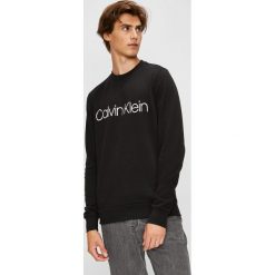 Calvin Klein - Bluza. Brązowe bluzy nierozpinane męskie Calvin Klein, l, bez wzorów, z bawełny, bez ramiączek, bez kaptura. W wyprzedaży za 319.90 zł.