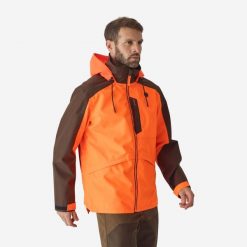 Kurtka Supertrack 500 fluo. Brązowe kurtki outdoor męskie SOLOGNAC, xl, bez wzorów, z poliesteru, bez kaptura, outdoorowe. Za 399.99 zł.