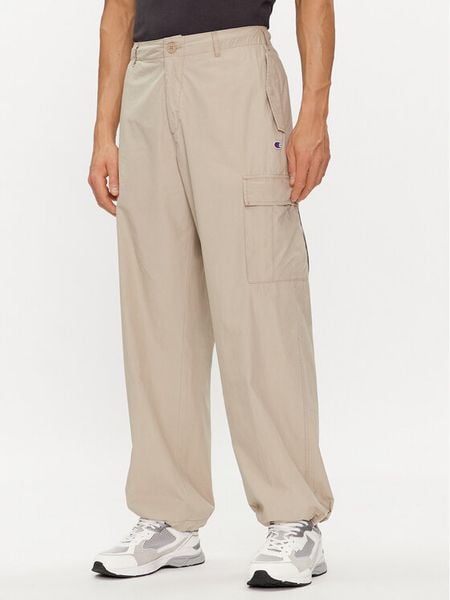 Champion Spodnie materiałowe 220015 Beżowy Custom Fit. Brązowe spodnie na co dzień męskie CHAMPION, bez wzorów, z bawełny. Za 279.99 zł.