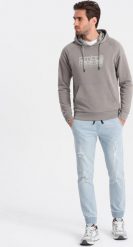 Ombre Męskie spodnie jeansowe JOGGERY z przetarciami - jasnoniebieskie V1 OM-PADJ-0150 XXL. Niebieskie długie spodnie sportowe męskie Ombre, bez wzorów, z jeansu. Za 99.99 zł.