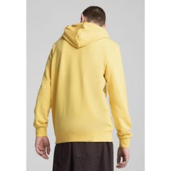 Męska bluza z kapturem Essentials z dwukolorowym logo No. 1 PUMA Sunny Yellow. Żółte bluzy z kapturem męskie Puma, m, bez wzorów, z gumy, z kapturem. Za 209.30 zł.