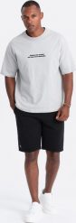 Ombre Krótkie spodenki męskie dresowe z dzianiny ottoman czarne V4 OM-SRSK-0150 S. Czarne szorty sportowe męskie Ombre, bez wzorów, z dresówki, sportowe. Za 99.99 zł.
