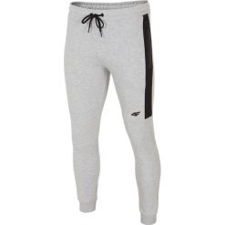 Spodnie dresowe męskie SPMD224 - szary melanż. Spodnie dresowe męskie marki 4f. W wyprzedaży za 119.99 zł.