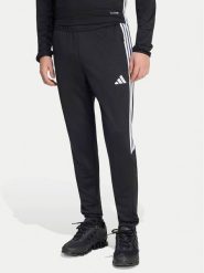 Adidas Spodnie dresowe Tiro 25 Essentials Training KG0809 Czarny Regular Fit. Czarne długie spodnie sportowe męskie ADIDAS, bez wzorów, z dresówki, do piłki nożnej. Za 199.99 zł.