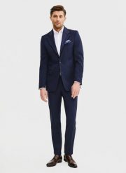 PAKO LORENTE – Wełniane spodnie garniturowe w kolorze granatowym. Eleganckie spodnie męskie Pako Lorente, bez wzorów, z wełny, biznesowe. Za 799.99 zł.