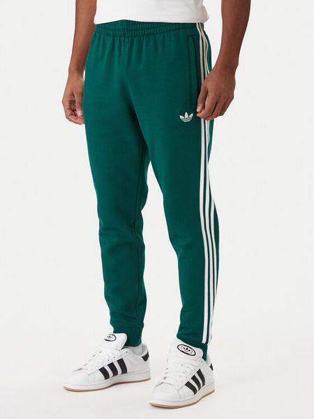 Adidas Spodnie dresowe 3-Stripes KE3559 Zielony Slim Fit. Zielone spodnie dresowe męskie ADIDAS, bez wzorów, z bawełny. Za 259.99 zł.