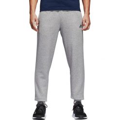 Adidas Spodnie męskie ESS T Pant FL szare r. L (BK7417). Długie spodnie sportowe męskie marki ADIDAS. Za 155.64 zł.