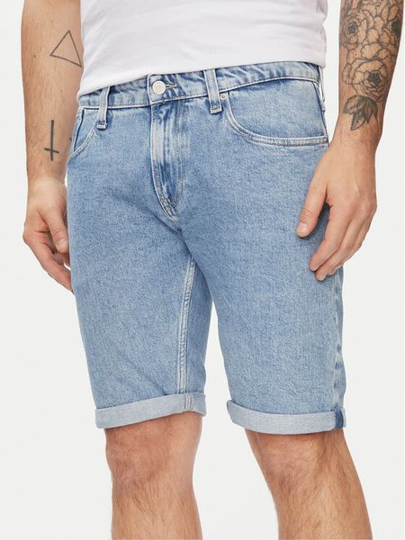 Tommy Jeans Szorty jeansowe Ronnie DM0DM19154 Niebieski Slim Fit. Niebieskie szorty męskie Tommy Jeans, bez wzorów, z bawełny. Za 189.99 zł.