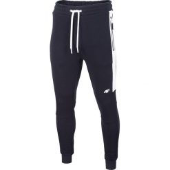 Spodnie dresowe męskie SPMD206 - ciemny granat. Spodnie dresowe męskie marki 4f. Za 149.99 zł.