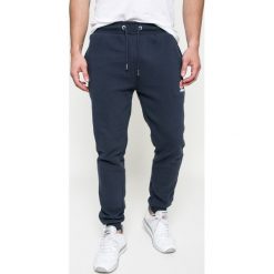 Ellesse - Spodnie. Szare spodnie na co dzień męskie Ellesse, z bawełny, casualowe. Za 199.90 zł.