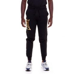 Męskie spodnie dresowe w kolorze złotym. Czarne spodnie dresowe męskie LEONE 1947 APPAREL, bez wzorów, z dresówki. Za 267.00 zł.
