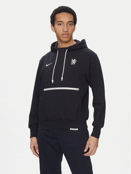 Nike Bluza Chelsea FC Standard Issue FN7766 Granatowy Regular Fit. Niebieskie bluzy nierozpinane męskie Nike, m, bez wzorów, z syntetyku, bez ramiączek, bez kaptura. Za 409.99 zł.