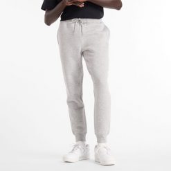 Spodnie męskie New Balance MP43904AG – szare. Szare spodnie dresowe męskie New Balance, bez wzorów, z bawełny. Za 149.99 zł.