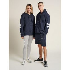 Kurtka z kapturem Hummel hmlLEGACY zip. Niebieskie kurtki męskie HUMMEL, xs, bez wzorów, sportowe, bez ramiączek, z kapturem. Za 194.00 zł.