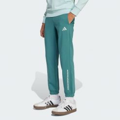 Spodnie adidas Slogan Fleece Pants. Niebieskie spodnie dresowe męskie ADIDAS, bez wzorów, z dresówki. W wyprzedaży za 96.85 zł.
