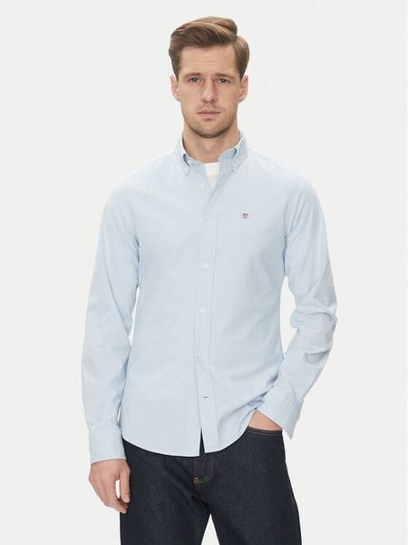 Gant Koszula Oxford 3230115 Błękitny Slim Fit. Niebieskie koszule męskie Gant, m, bez wzorów, z bawełny, bez kołnierzyka, bez ramiączek. Za 279.99 zł.