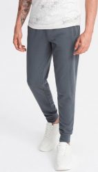 Ombre Bawełniane dresowe spodnie męskie joggery BASIC grafitowe V11 OM-PABS-0174 M. Szare długie spodnie sportowe męskie Ombre, bez wzorów, z bawełny. Za 129.99 zł.