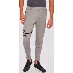 Under Armour - Spodnie. Szare spodnie dresowe męskie marki Under Armour, z dzianiny. W wyprzedaży za 199.90 zł.