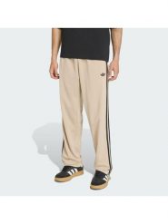 Adidas Spodnie dresowe Firebird KE6679 Beżowy Loose Fit. Brązowe spodnie dresowe męskie ADIDAS, bez wzorów, z dresówki. Za 279.99 zł.