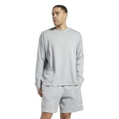 Bluza z dekoltem w kolorze naturalnym Reebok Classics. Szare bluzy nierozpinane męskie Reebok, s, bez wzorów, sportowe, bez ramiączek, bez kaptura. W wyprzedaży za 232.95 zł.