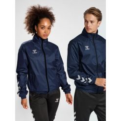 Kurtka ortalionowa piłkarska dla dorosłych Hummel Core XK Spray Jacket. Niebieskie kurtki męskie HUMMEL, xl, bez wzorów, sportowe, bez ramiączek, bez kaptura. Za 204.50 zł.