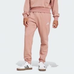 Spodnie polarowe Essentials Feelcozy. Białe spodnie dresowe męskie ADIDAS, bez wzorów, z polaru. W wyprzedaży za 173.35 zł.