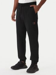 HUGO Spodnie dresowe Danopan 50553146 Czarny Relaxed Fit. Czarne spodnie dresowe męskie Hugo, bez wzorów, z bawełny. Za 549.99 zł.