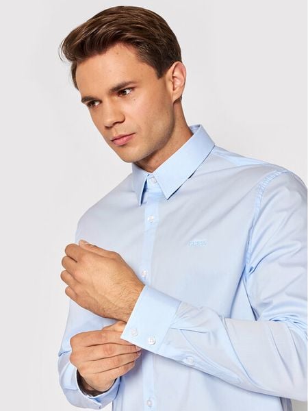 Guess Koszula Sunset M1YH20 W7ZK1 Błękitny Slim Fit. Niebieskie koszule męskie Guess, m, z aplikacjami, z bawełny, bez kołnierzyka, bez ramiączek. Za 192.00 zł.