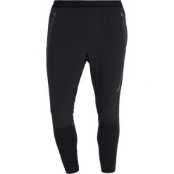 Nike Performance SWIFT RUN PANT Spodnie treningowe black/reflective silver. Długie spodnie sportowe męskie marki Nike Performance. Za 399.00 zł.