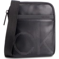 Saszetka CALVIN KLEIN - Ck Up Mini Flat Crossover K50K504353 001. Saszetki męskie Calvin Klein. W wyprzedaży za 239.00 zł.