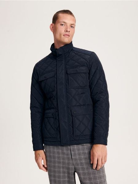 Kurtka pikowana - granatowy. Niebieskie kurtki męskie Reserved, l, bez wzorów, z tkaniny, bez ramiączek, bez kaptura. W wyprzedaży za 69.99 zł.