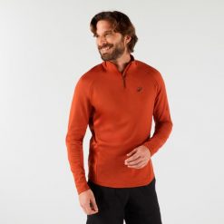 Bluza tenisowa termoaktywna męska Thermic na krótki suwak. Brązowe bielizna termoaktywna męska ARTENGO, m, bez wzorów, z elastanu, bez ramiączek, tenisowe. Za 89.99 zł.