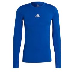 Koszulka męska adidas Compression Long Sleeve Tee. Niebieskie bielizna termoaktywna męska ADIDAS, m, bez wzorów, bez ramiączek, do piłki nożnej. Za 79.09 zł.
