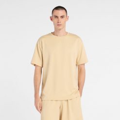 Koszulka męska New Balance MT6100FRABC – żółta. Żółte t-shirty sportowe męskie New Balance, m, bez wzorów, z materiału, sportowe, bez ramiączek. Za 149.99 zł.