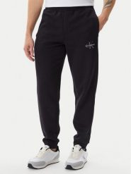 Calvin Klein Jeans Spodnie dresowe LV040BM802 Czarny Regular Fit. Czarne spodnie dresowe męskie Calvin Klein Jeans, bez wzorów, z bawełny. Za 209.99 zł.