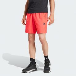 Train Essentials Woven Training Shorts. Czarne buty treningowe męskie ADIDAS, bez wzorów, z materiału, sportowe. W wyprzedaży za 111.20 zł.