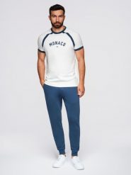 Spodnie męskie dresowe typu jogger - granatowe V4 - Rozmiar: L. Niebieskie spodnie dresowe męskie Ombre Clothing, bez wzorów, z bawełny. W wyprzedaży za 101.24 zł.