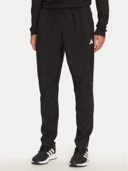 Adidas Spodnie dresowe Own The Run IK5024 Czarny Regular Fit. Czarne długie spodnie sportowe męskie ADIDAS, bez wzorów, z dresówki, do biegania. Za 199.99 zł.