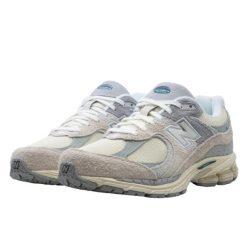 Buty do chodzenia dla dorosłych New Balance 2002R Linen. Brązowe buty do biegania męskie New Balance, bez wzorów, z gumy, bez zapięcia, do biegania. W wyprzedaży za 552.10 zł.