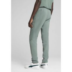 Męskie spodnie EVOSTRIPE PUMA Green Moon. Zielone spodnie dresowe męskie Puma, bez wzorów, z dresówki. W wyprzedaży za 149.00 zł.
