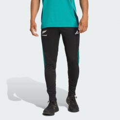 Spodnie treningowe All Blacks. Czarne długie spodnie sportowe męskie ADIDAS, bez wzorów, do piłki nożnej. W wyprzedaży za 168.35 zł.
