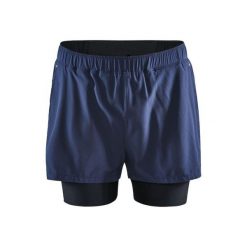 Szorty Craft 2-in-1 adv essence stretch. Niebieskie szorty sportowe męskie Craft, bez wzorów, sportowe. W wyprzedaży za 215.20 zł.
