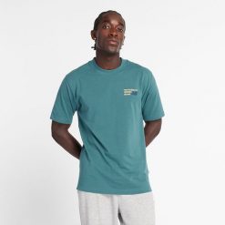 Koszulka męska New Balance MT41908NUS – niebieska. Niebieskie t-shirty sportowe męskie New Balance, l, z aplikacjami, z bawełny, klasyczne, bez ramiączek. Za 69.99 zł.