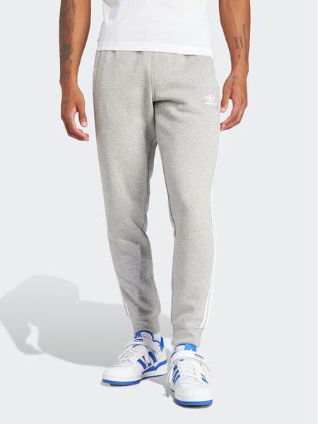 Adidas Spodnie dresowe adicolor 3-Stripes IM9318 Szary Slim Fit. Szare spodnie dresowe męskie ADIDAS, bez wzorów, z dresówki. Za 179.99 zł.