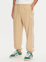 Adidas Spodnie dresowe adicolor 3-Stripes IZ2490 Beżowy Regular Fit. Brązowe spodnie dresowe męskie ADIDAS, bez wzorów, z dresówki. Za 179.99 zł.