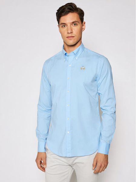 La Martina Koszula Poplin CCMC02 PP003 Błękitny Slim Fit. Niebieskie koszule męskie La Martina, m, bez wzorów, z bawełny, bez kołnierzyka, bez ramiączek. Za 299.99 zł.