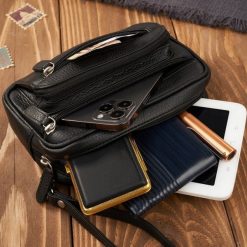 Paolo Peruzzi Saszetka męska do ręki skórzana czarna pojemna T-130-BL. Czarne saszetki męskie Paolo Peruzzi, bez wzorów. Za 178.58 zł.