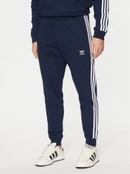 Adidas Spodnie dresowe adicolor 3-Stripes IM9319 Granatowy Slim Fit. Niebieskie spodnie dresowe męskie ADIDAS, bez wzorów, z dresówki. Za 189.99 zł.